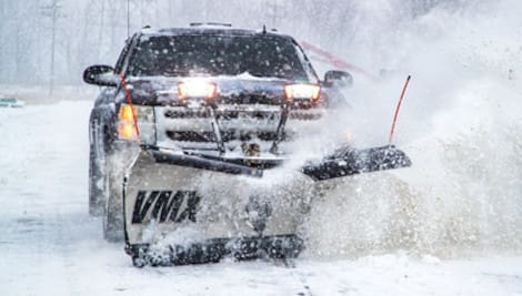 SnowDogg® VMX Snow Plow being used on a pickup truck to plow snow, SaltDogg Snow Plows sold by Duke's A&W